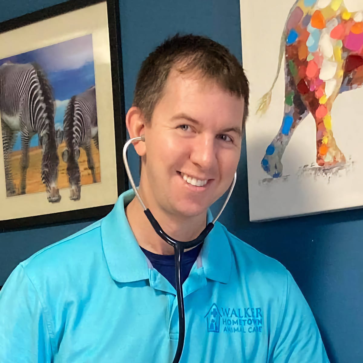 Walker Hometown Animal Care veterinarian Dr. Walker; smiling man with a stethoscope