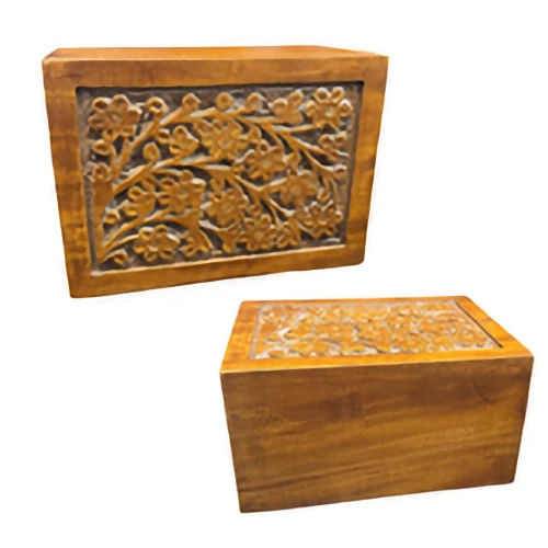 A warm, medium brown wooden memorial box featuring a deeply carved panel of blooming floral patterns.